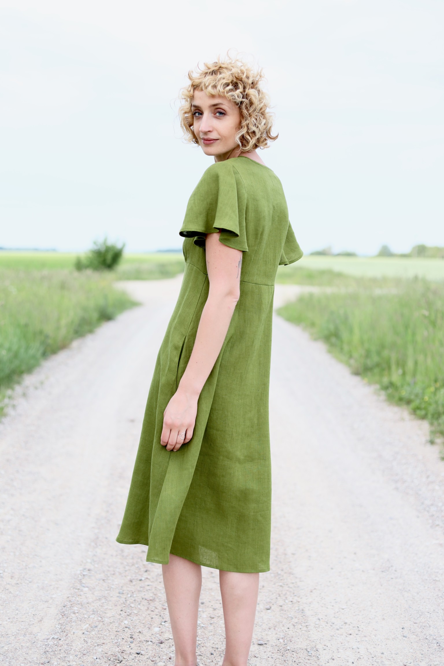Linen dress with frill sleeves in moss green color – OffOn