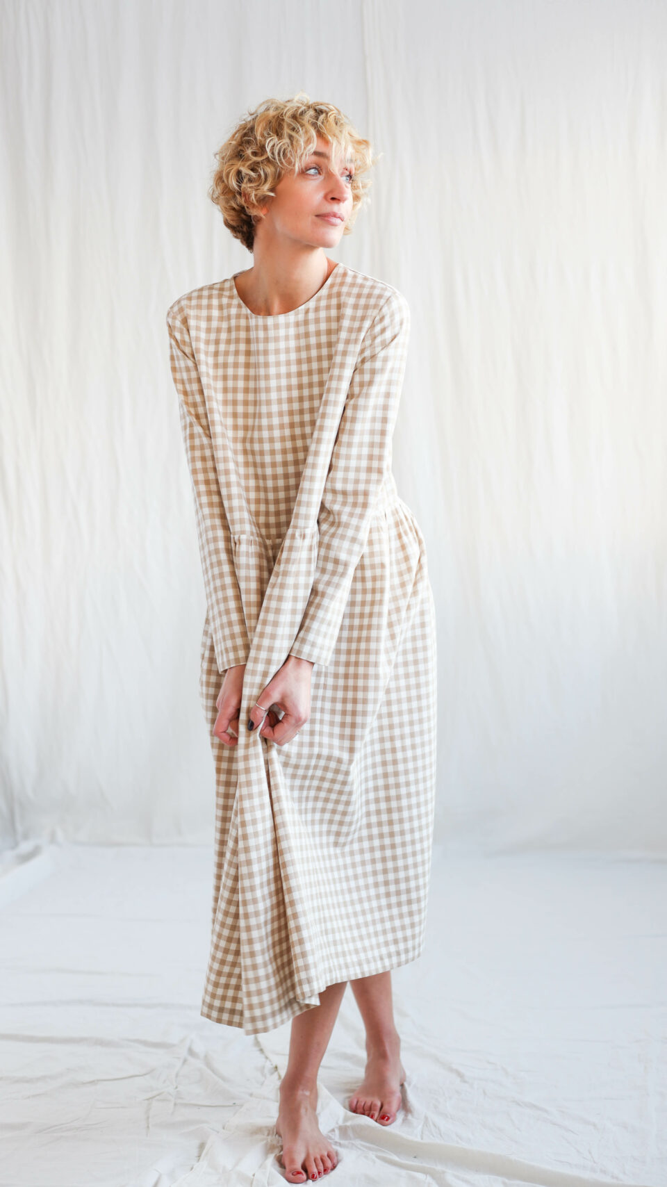 Long sleeve loose fit smock dress in beige checks | Dress | Sustainable clothing | OffOn clothing