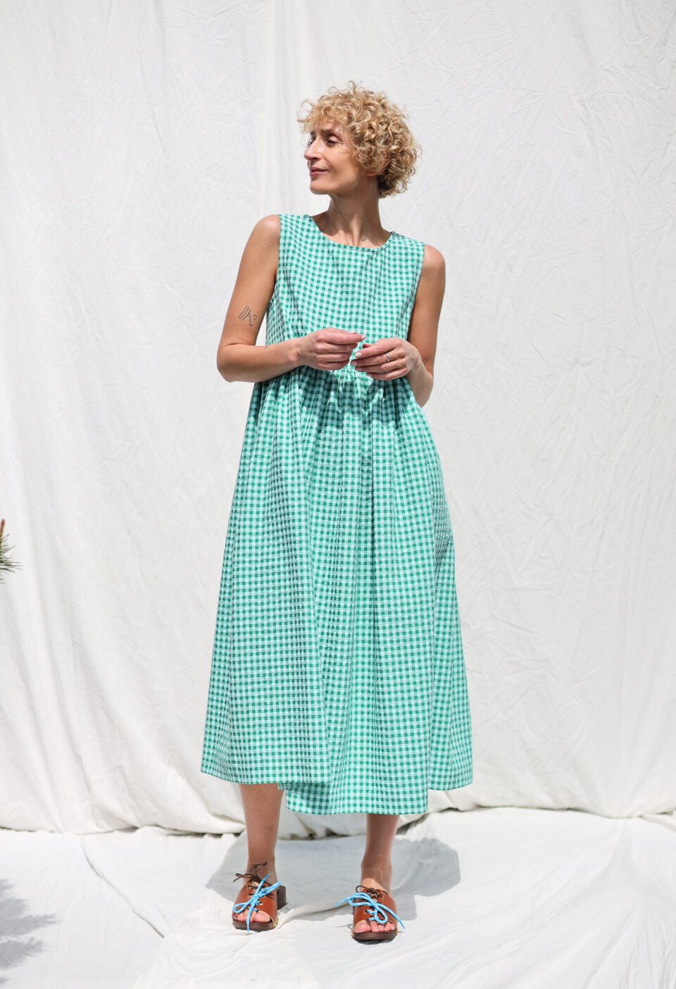 Sleeveless smock dress in jungle green seersucker checks | Dress | Sustainable clothing | OffOn clothing