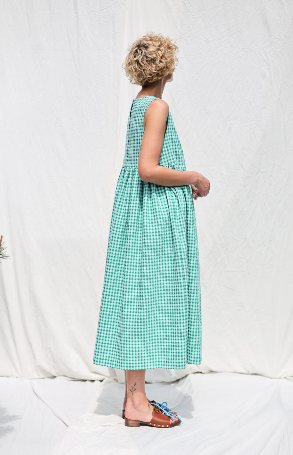 Sleeveless smock dress in jungle green seersucker checks - Image 1