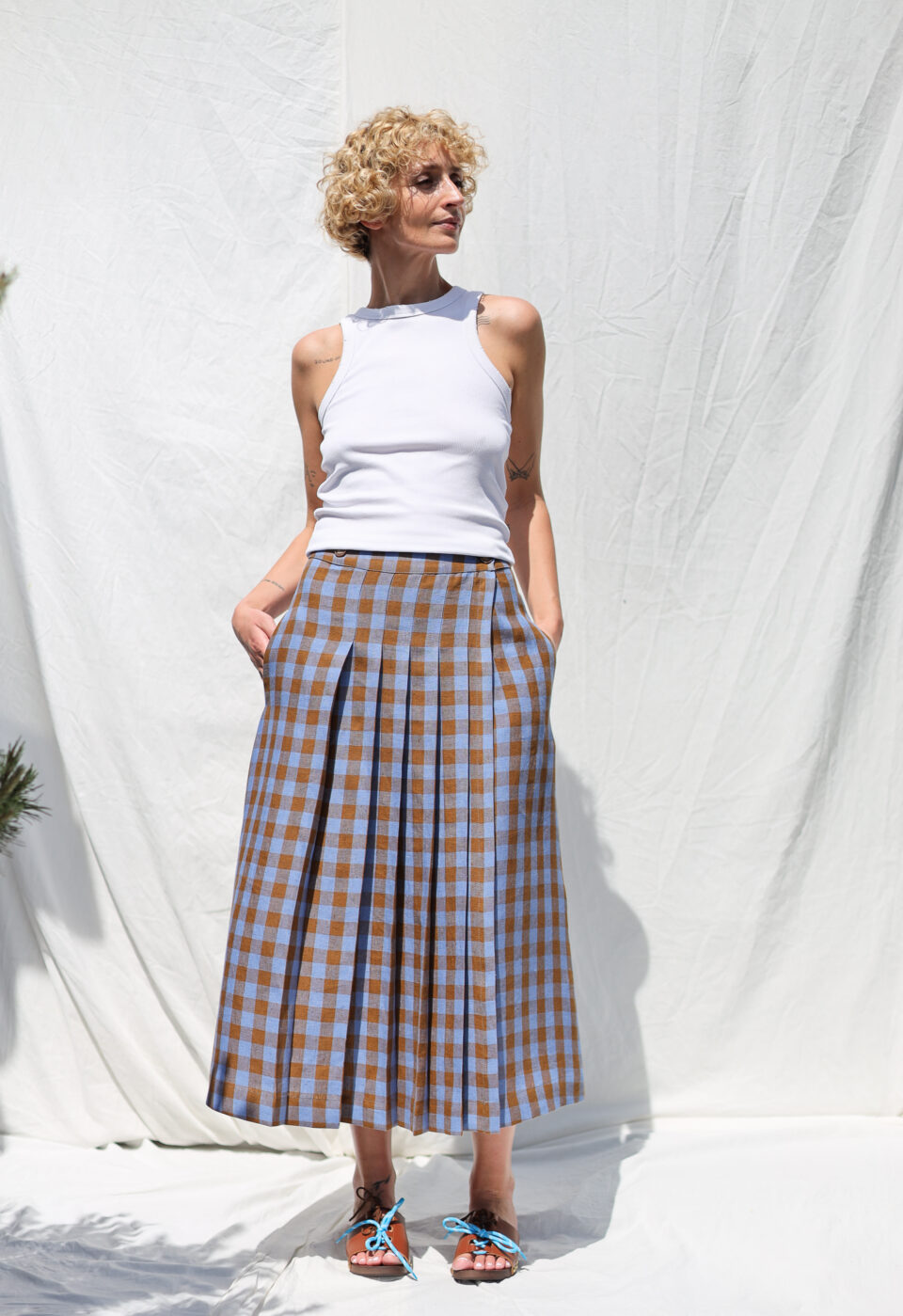 Front pleated wrap linen skirt in bluebonnet checks | Skirt | Sustainable clothing | OffOn clothing