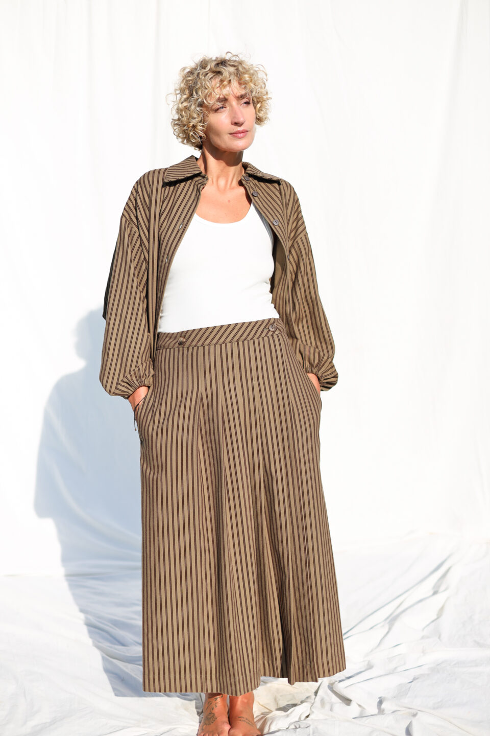 Front pleated wrap skirt in khaki striped skirt - Image 1