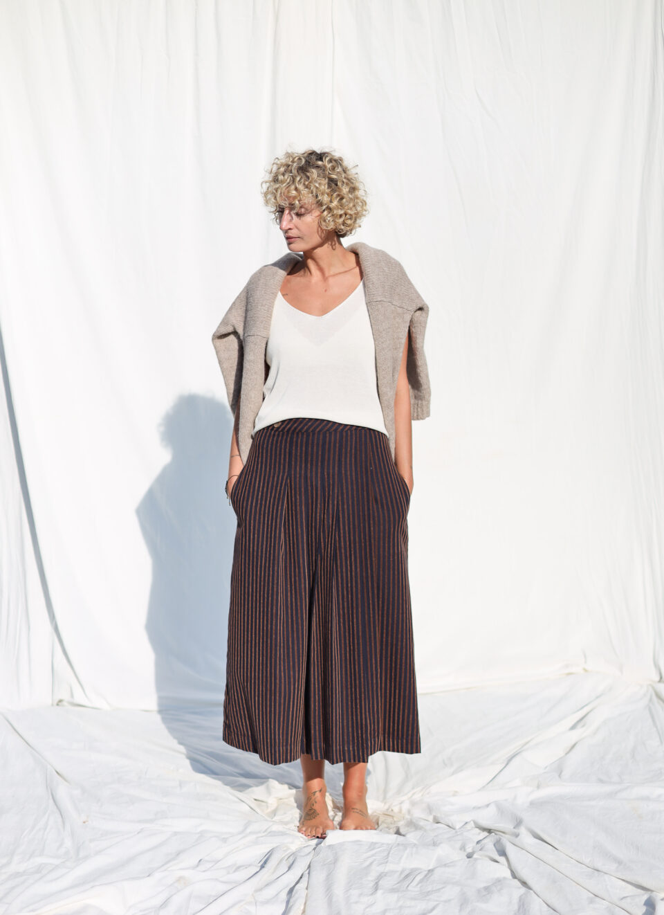 Front pleated wrap skirt in velvety navy blue stripes - Image 1